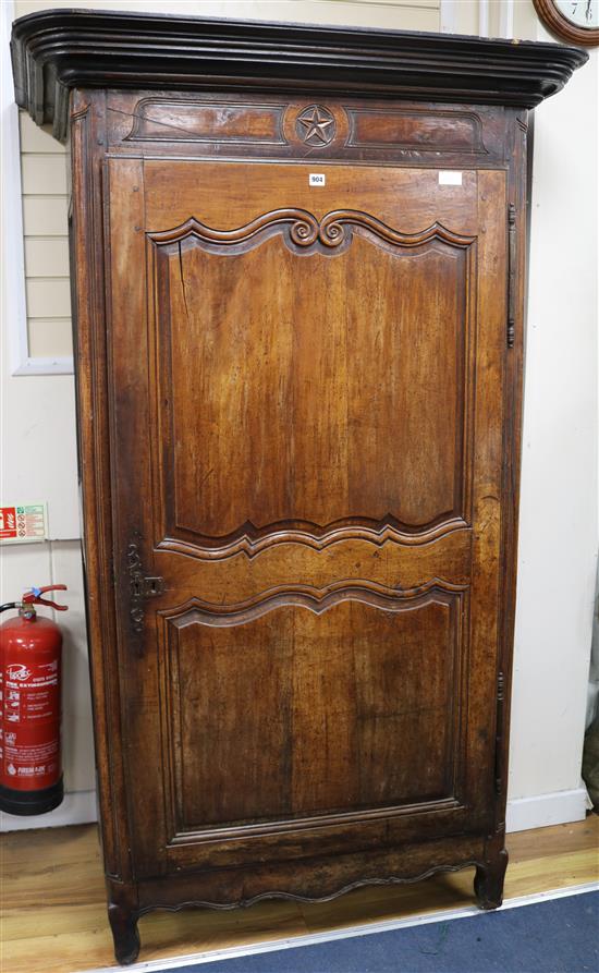 A 19th century French chestnut armoire, with panel carved door, W.3ft 11in. H.6ft 6in.